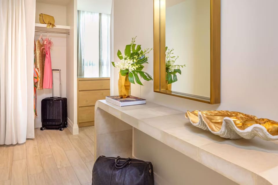 Unpack effortlessly with a sleek vanity and spacious closet.