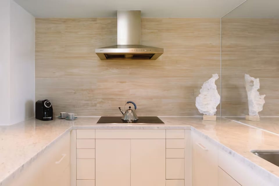 Sip morning coffee in a spotless, modern kitchenette nook.