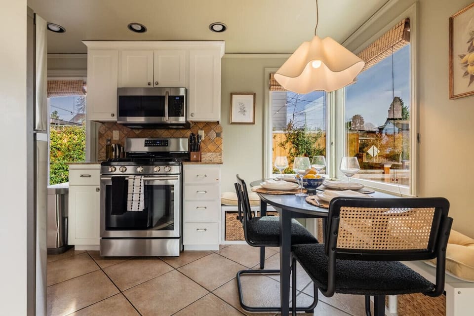 Fully equipped kitchen with a cozy dining nook — perfect for casual meals or morning coffee.