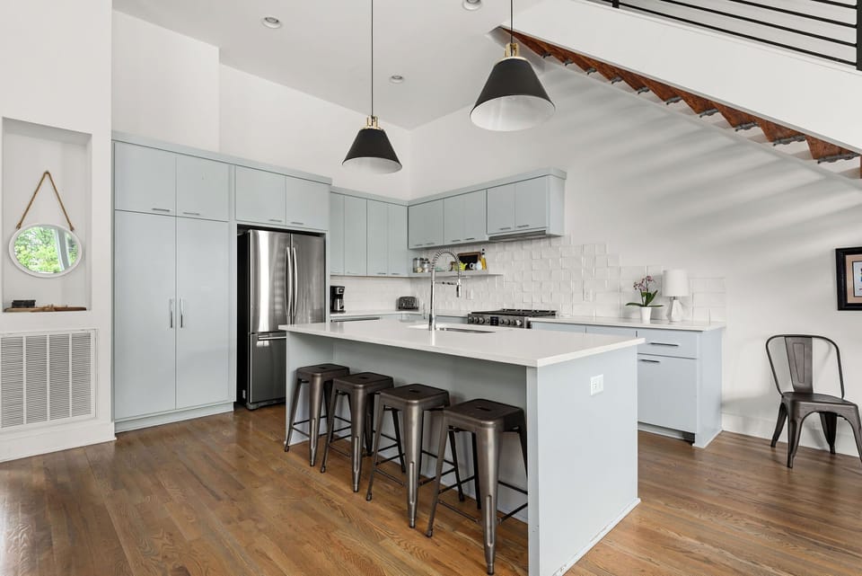 Kitchen features coffee pot, french press, tea kettle, and plenty of wine glasses!