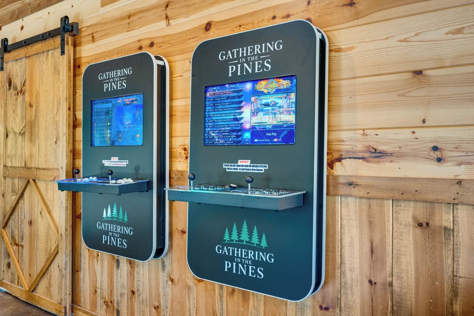 Rustic game room with dual arcade machines for family-friendly fun