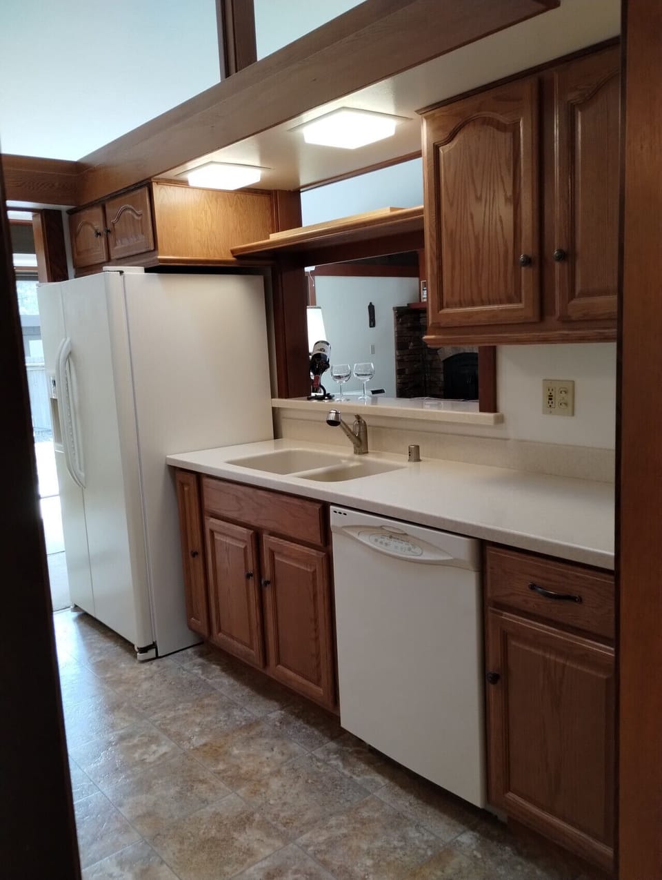 Kitchen opens to the living area so you can visit with your guests while preparing meals