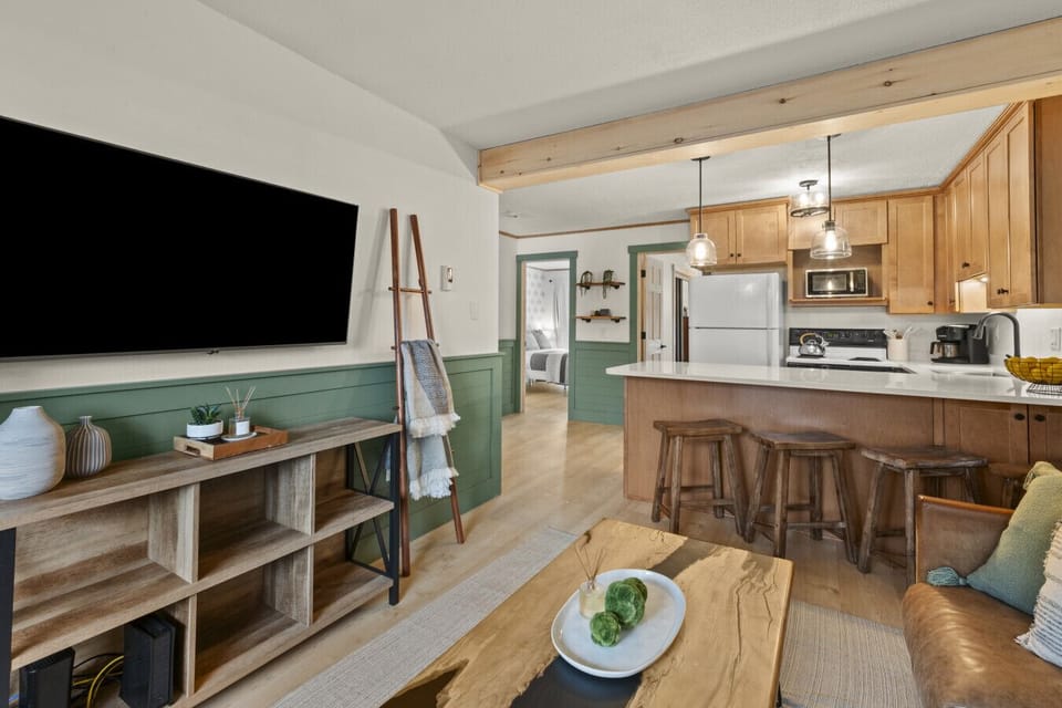 This wide-open layout is designed for family connection, offering plenty of room for the kids to play while the adults relax by the fire.