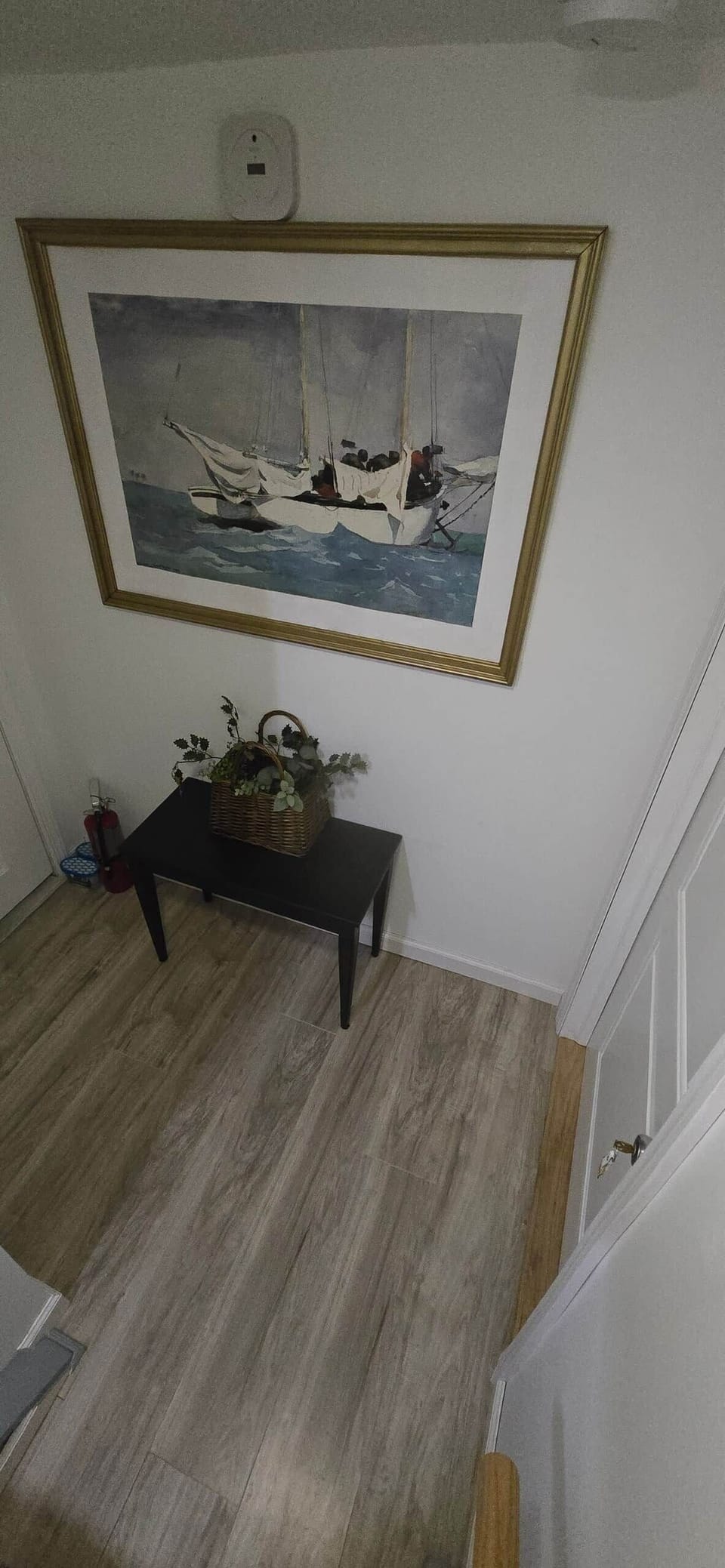 Table outside the room with a spare room key, just in case 