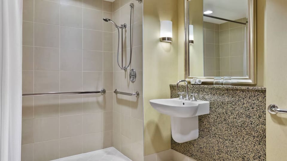 Rinse off easily in a bright, accessible walk-in shower.