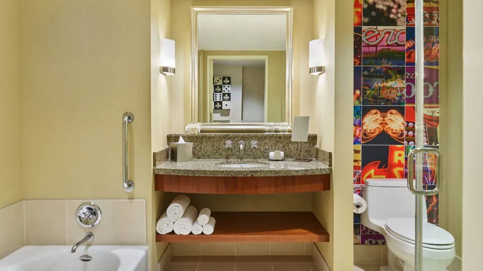 Soak and recharge with a full tub and spa-like vanity.