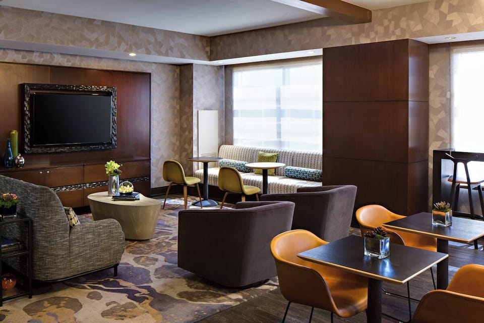 Gather with friends in a relaxed lounge with cozy seating.
