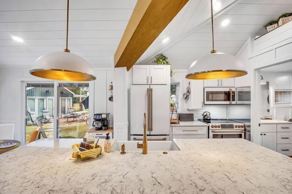 Sunrise cottage - Full kitchen has everything you need to prepare meals. Just steps to the kitchen table, large island counter or out the side slider to the waiting picnic table and large poly wood chairs.