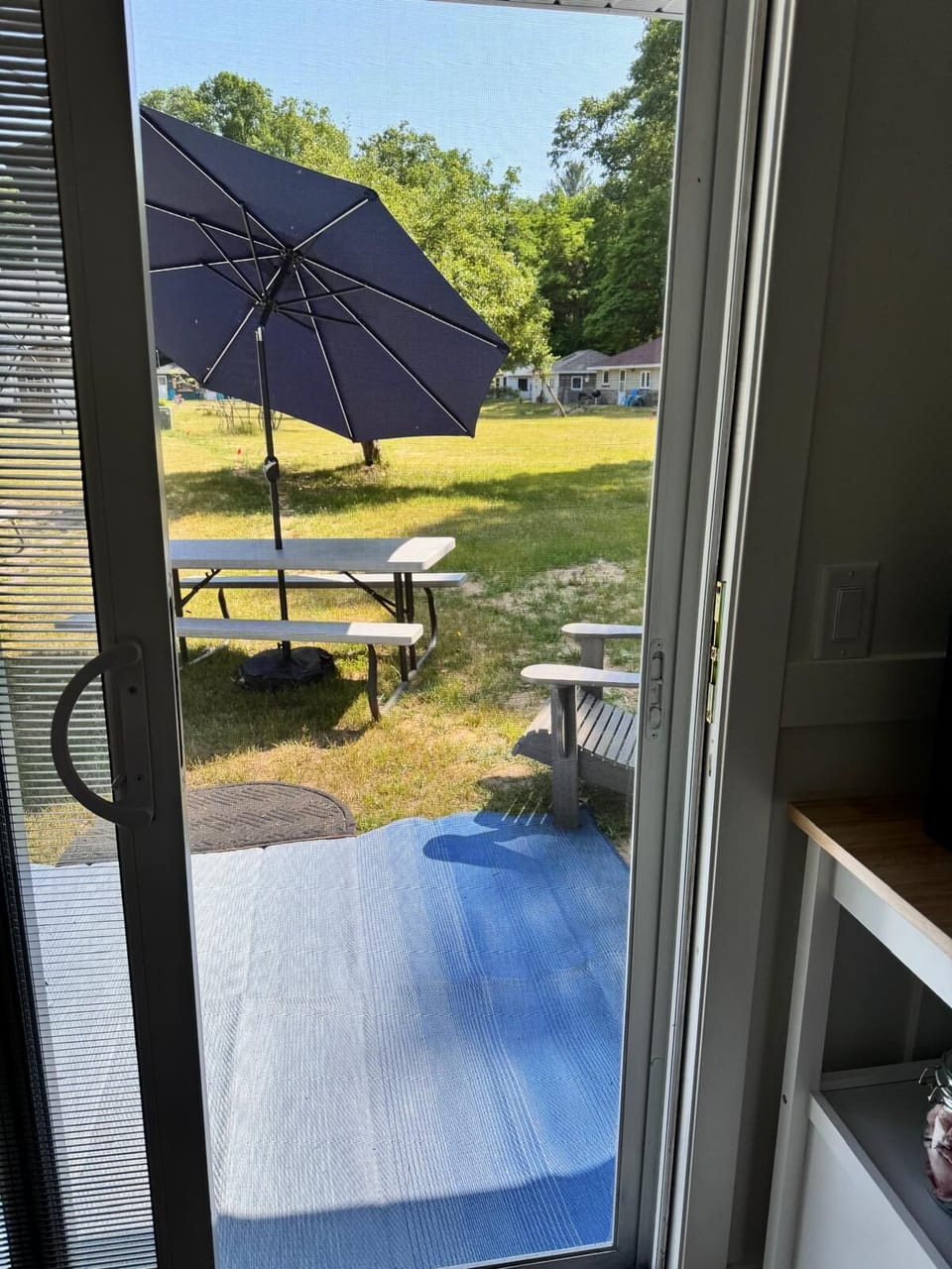 Sunrise Cottage  - Step through this entrance to reach the side yard, where a fire pit invites you to relax and enjoy warm, cozy