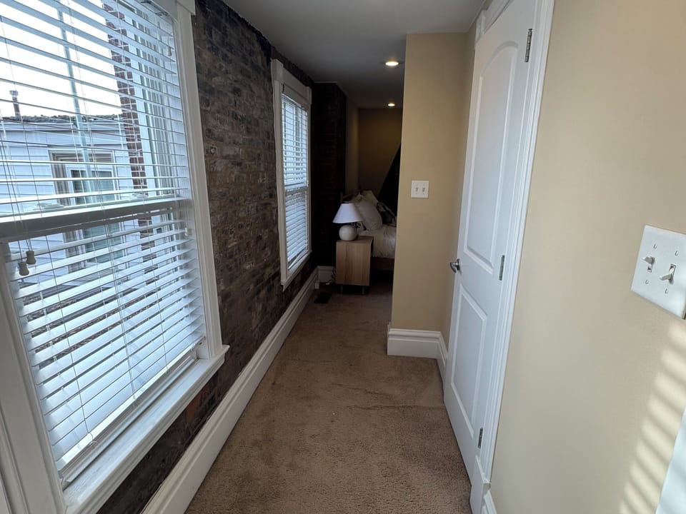 Guest walk in closet walk way to bathroom