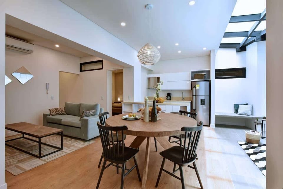 Dining table - the natural light comes from the pergola on the right.