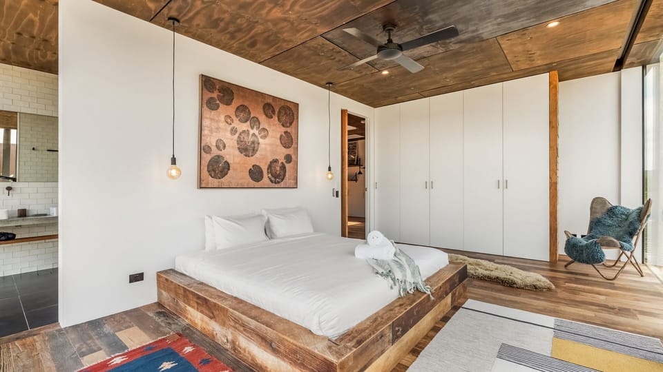 Comfortable bedroom with warm timber finishes and a relaxed feel.
