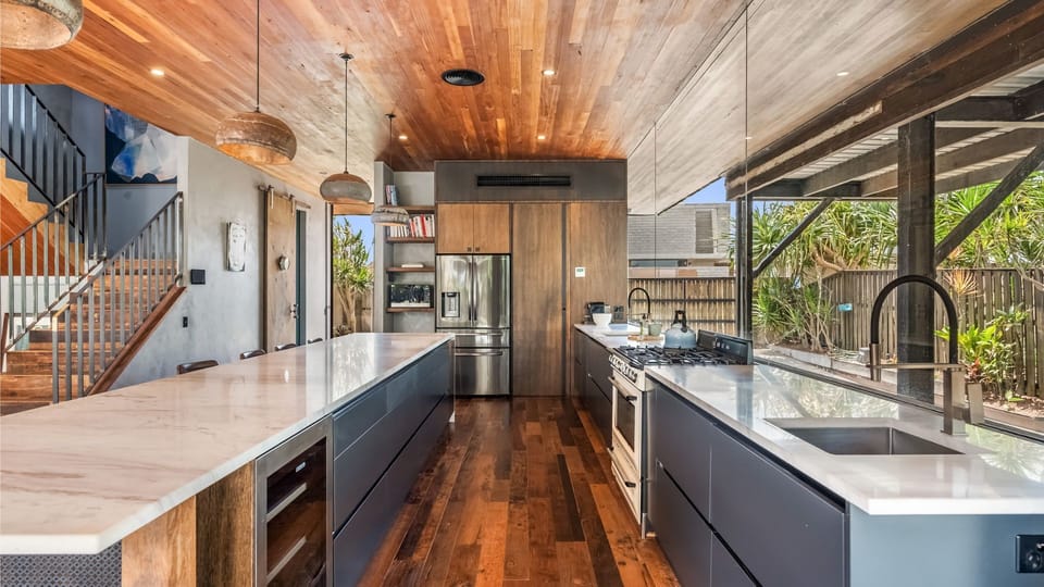 Spacious open-plan kitchen with a large island, perfect for cooking and gathering.