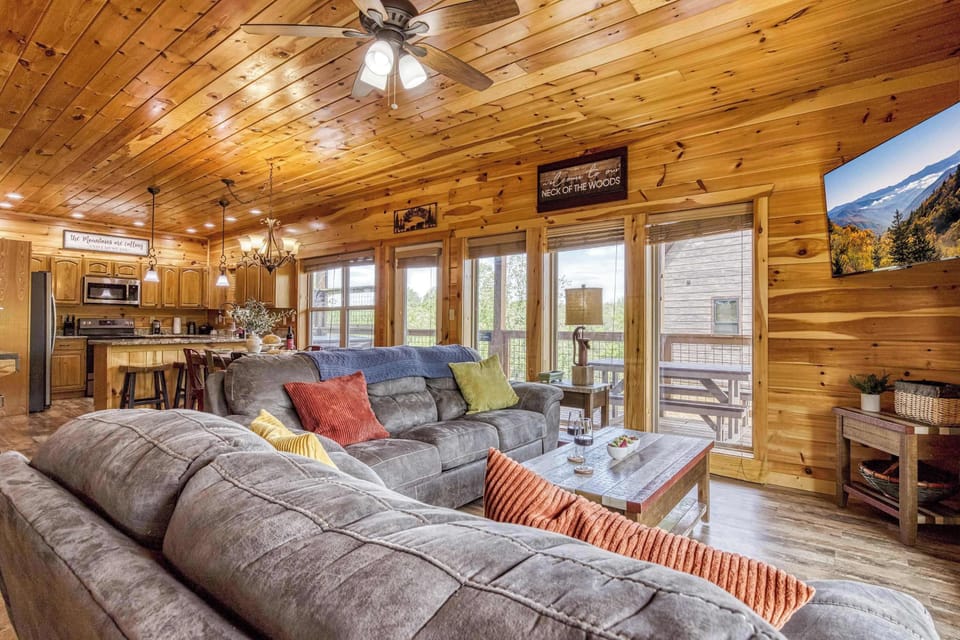Main Living Room - Settle in for quiet mornings or lively evenings in this inviting living space flowing into the kitchen and dining area.