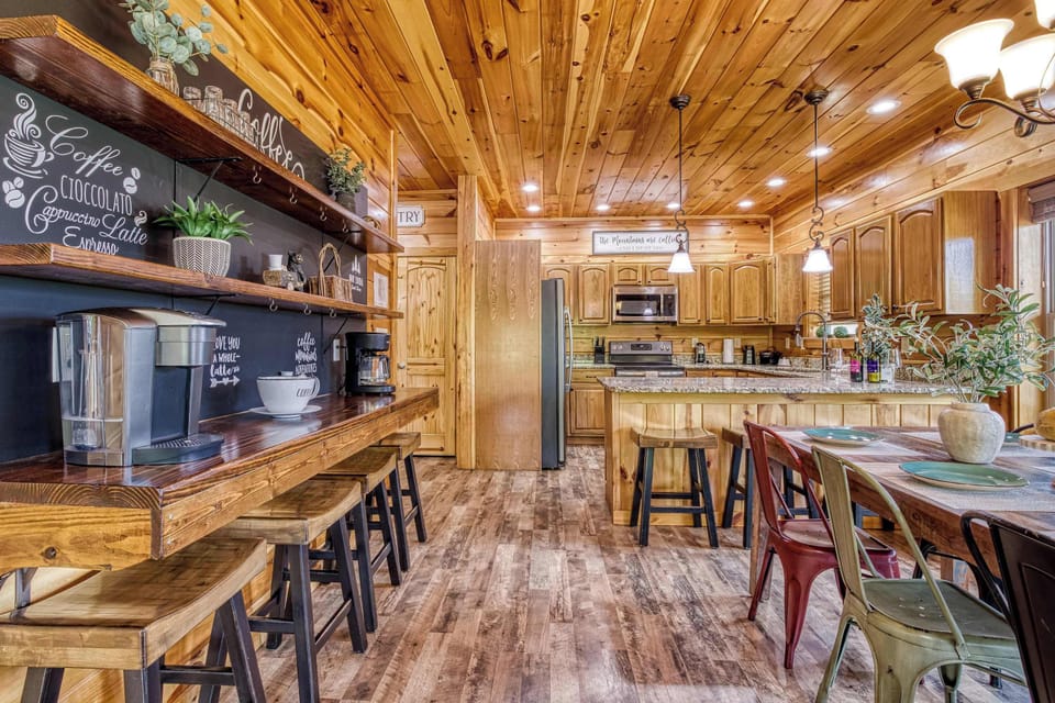 Dining Area - Start your mornings at the full coffee bar before gathering around the dining table in this open, connected space.