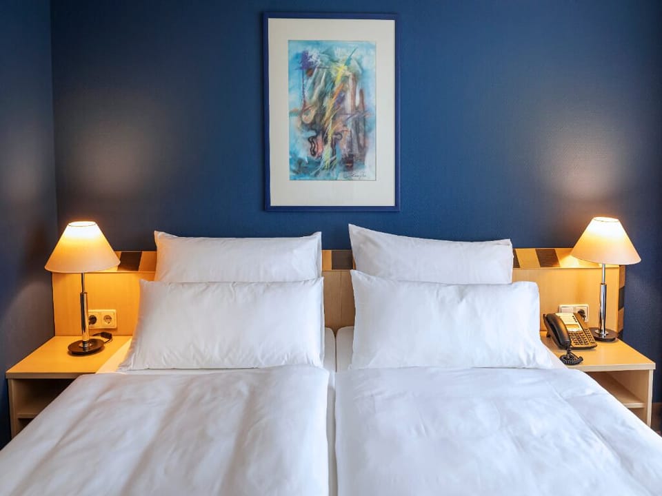 Sleep soundly in a serene room with soothing colors.