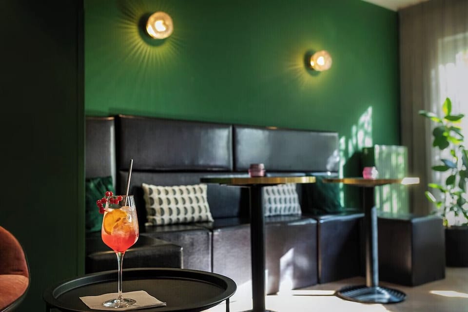 Toast the evening with a colorful cocktail in velvet comfort.
