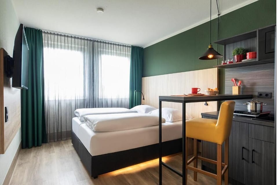 Wake up to soft daylight in a bright, modern studio.