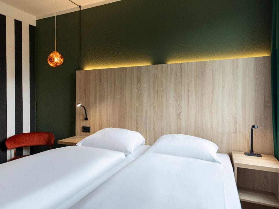 Enjoy a calm night’s sleep in this serene, minimalist room.