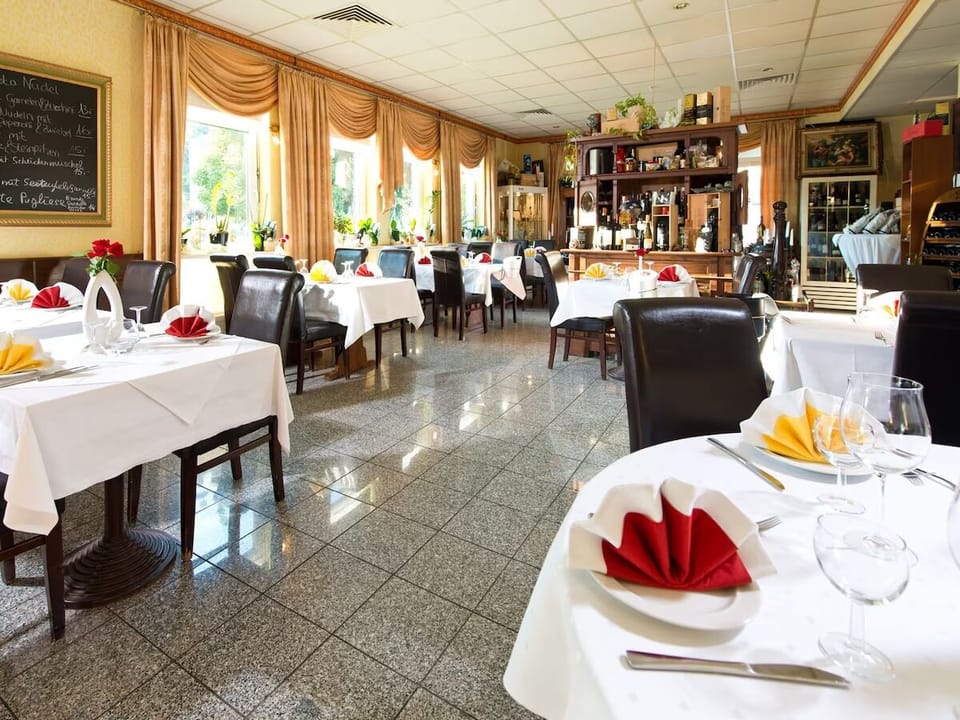 Savor a relaxed dinner in a classic, cozy dining room.
