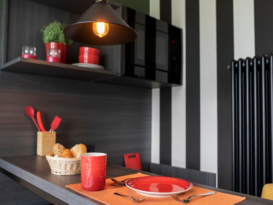 Linger over breakfast with stylish accents and warm pendant glow.