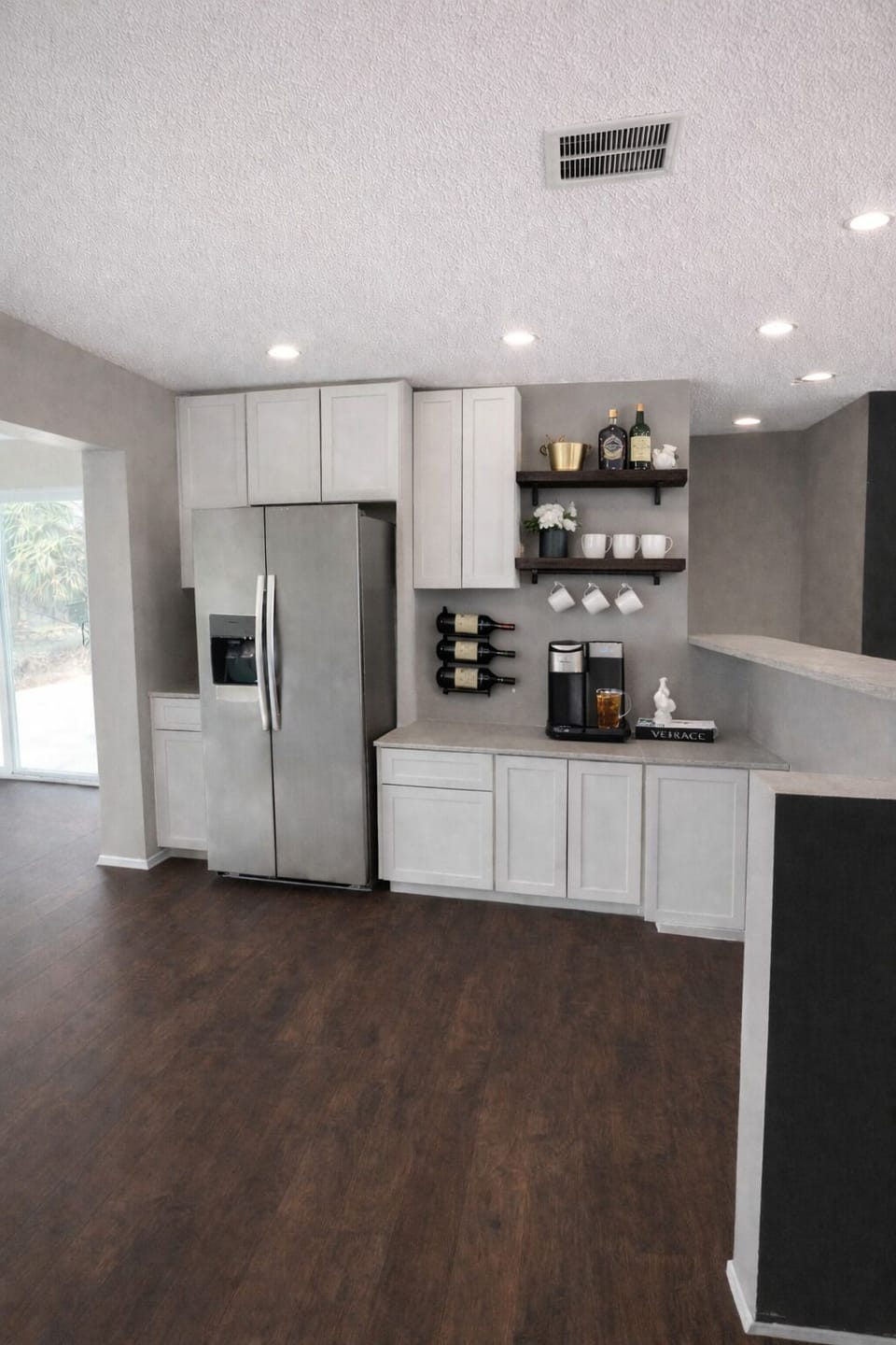 Fully stocked kitchen with wine & coffee bar.