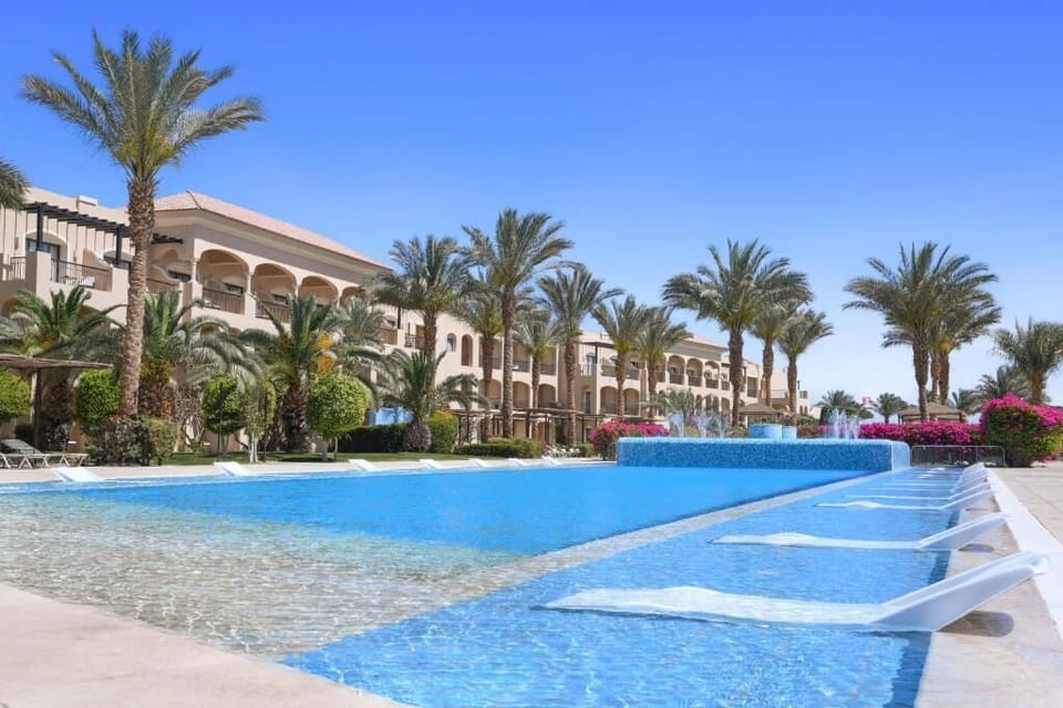 Glide into crystal water with palms swaying overhead.