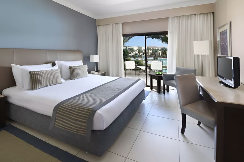 Unwind in a crisp king bed after sunlit days.