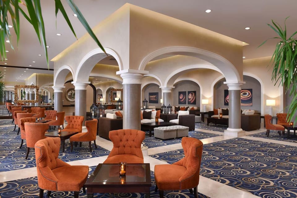 Linger in the elegant lobby lounge with plush, quiet seating.