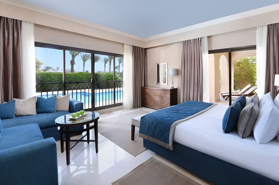 Sip coffee beside pool views from your serene suite.