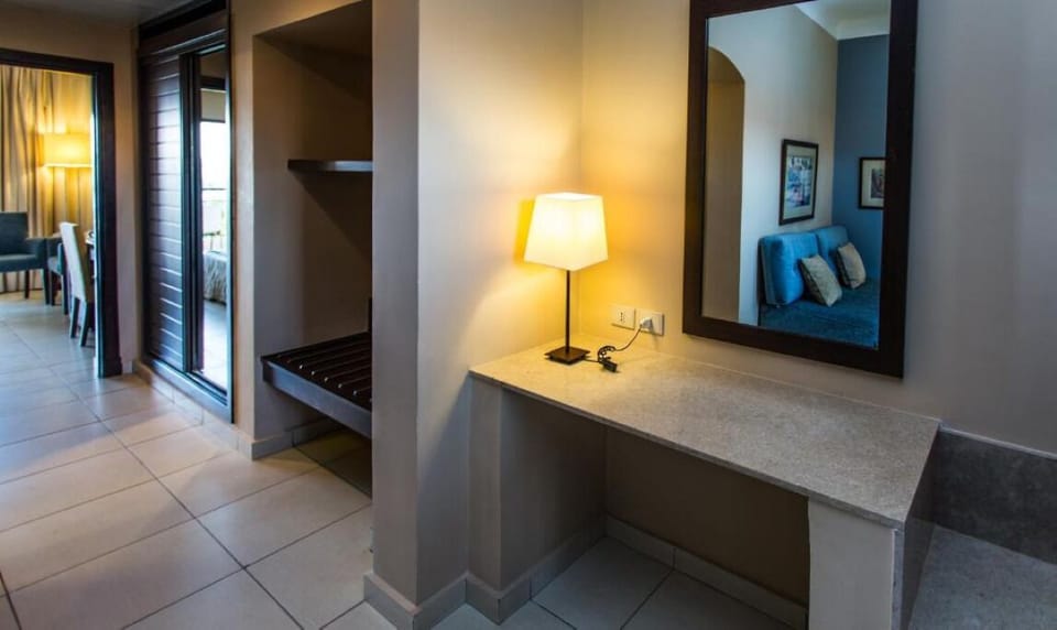 Settle in with a handy vanity nook and luggage bench.