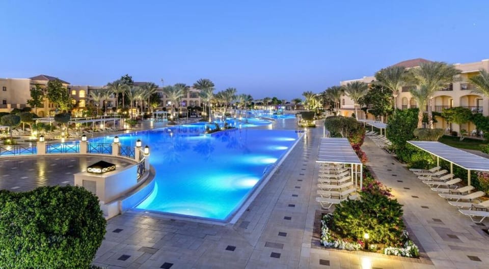 Stroll beside glowing blue waters for a peaceful evening unwind.