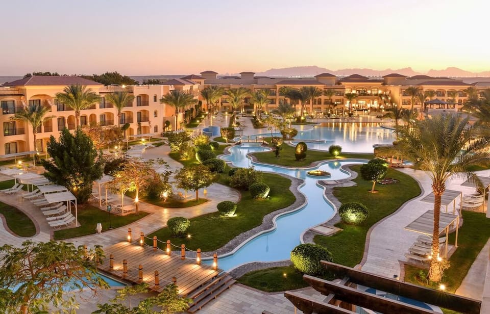 Escape into a glowing resort oasis with winding lagoons.