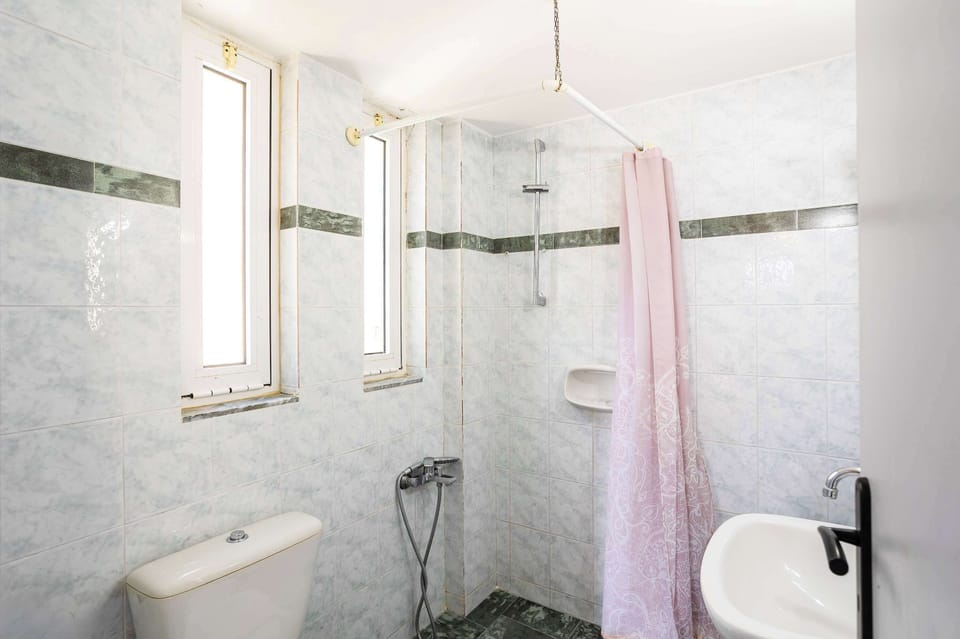 Bathroom with Walk-In Shower and Bright Interior