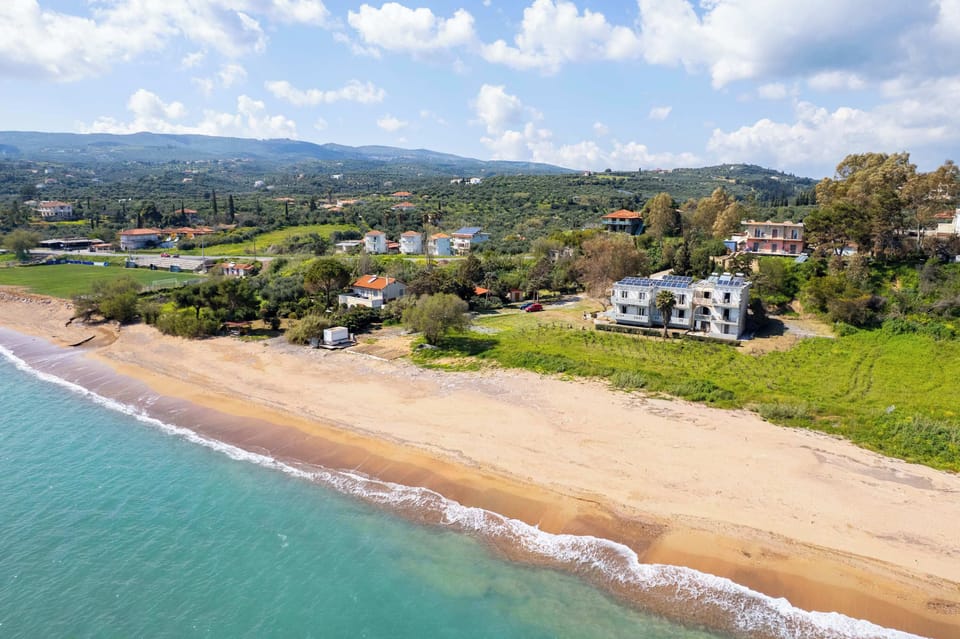 Sandy Beach View with Clear Water and Coastline Memi Sandy beach just a few steps away from the property