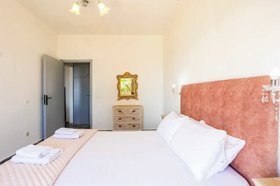 Cozy Bedroom with Double Bed and Warm Lighting