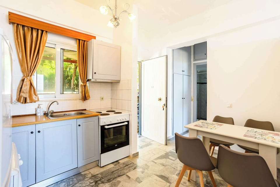 Open Kitchen and Dining Area with Direct Outdoor Access