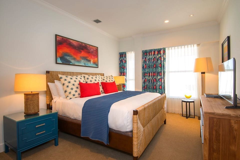 Vibrant and inviting, this bedroom invites relaxation with playful patterns and rich hues that capture the spirit of coastal living. A perfect retreat for rejuvenation after sun-soaked adventures.