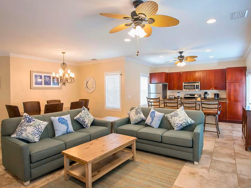 Gather last-minute memories in the airy living area—a perfect blend of coastal decor and modern conveniences to inspire laughter and joy.