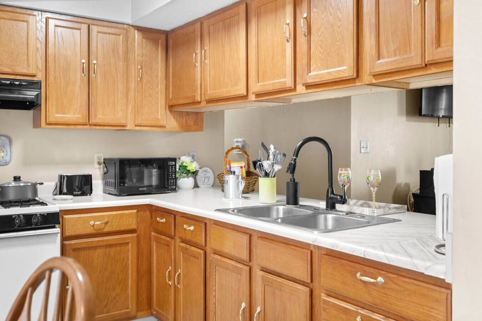 Kitchen | Double Sink | Wood Cabinetry & Counter Workspace