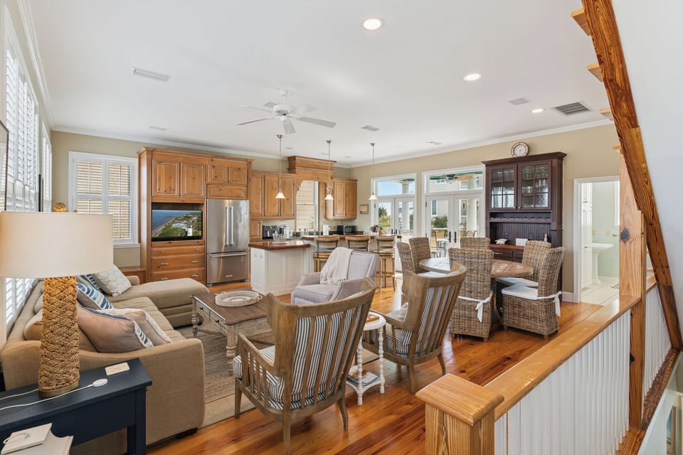 Relax in your spacious open-concept retreat with gleaming hardwood floors, modern kitchen, and cozy seating areas perfect for gathering.
