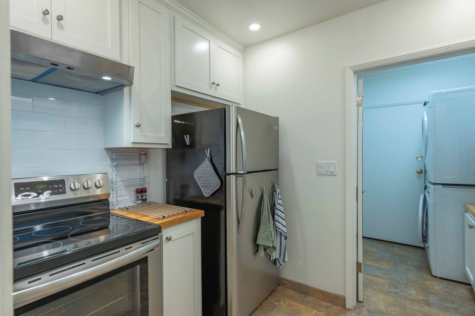 Your fully equipped kitchen features modern appliances and plenty of storage, perfect for preparing meals during your stay.