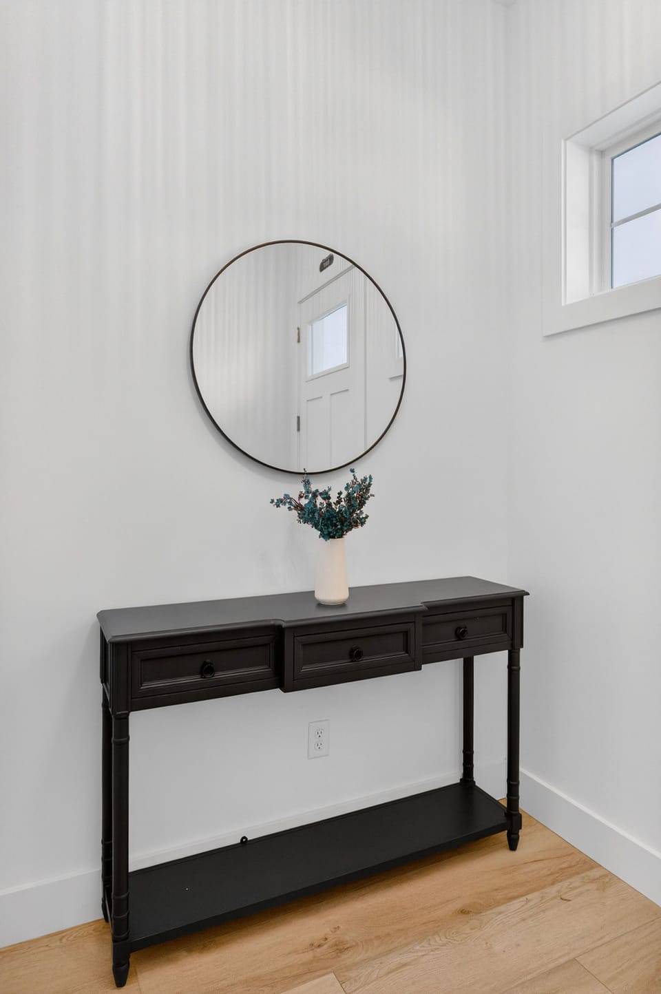 A chic entryway greets you with contemporary flair and thoughtful, welcoming details.