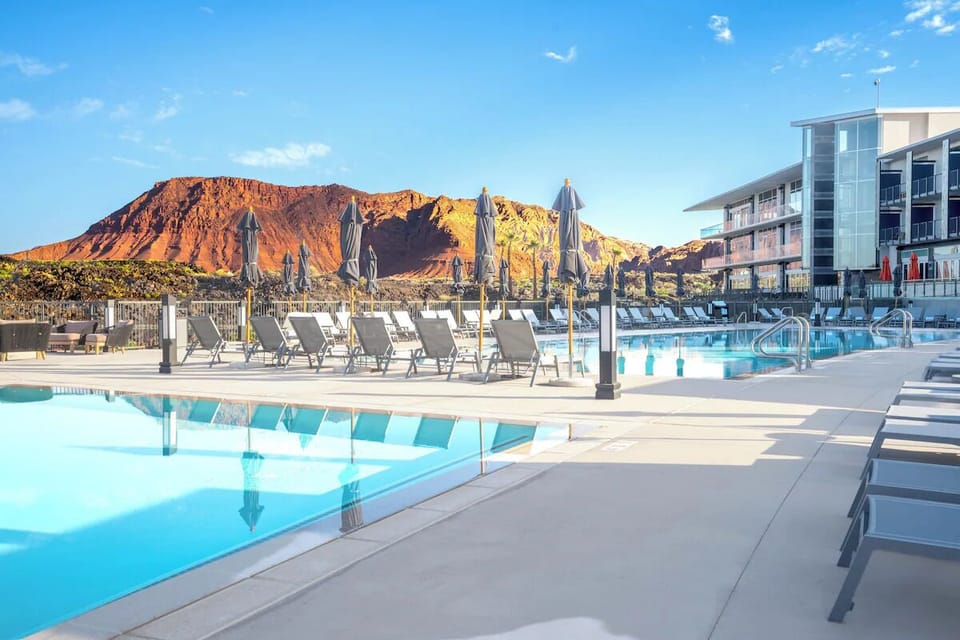Dive into sunlit waters with dramatic red-rock views.
