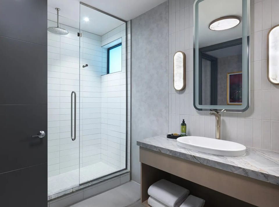 Refresh in a spa-like bath with a bright glass shower.