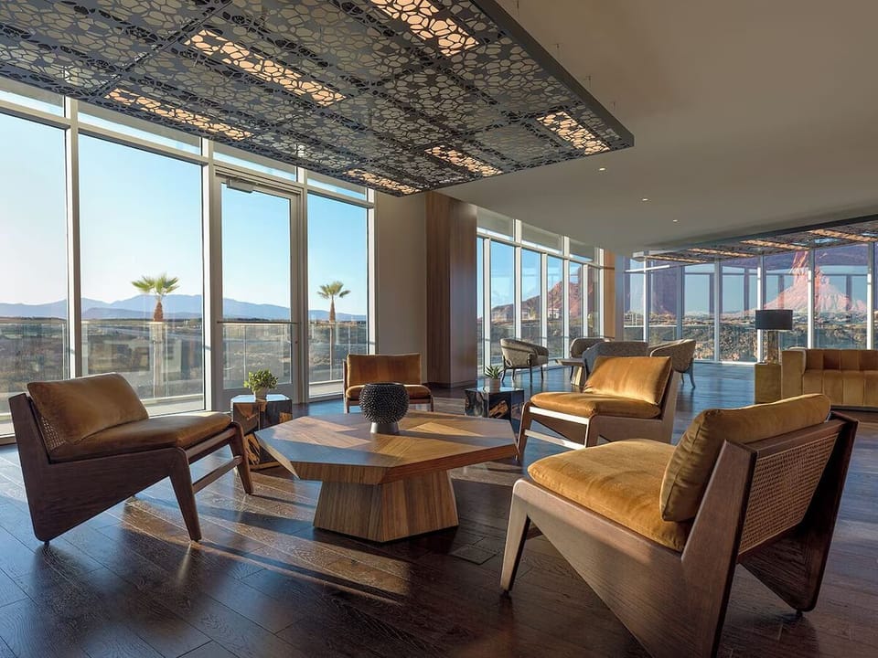 Unwind in sunlit lounge seating with sweeping canyon views.