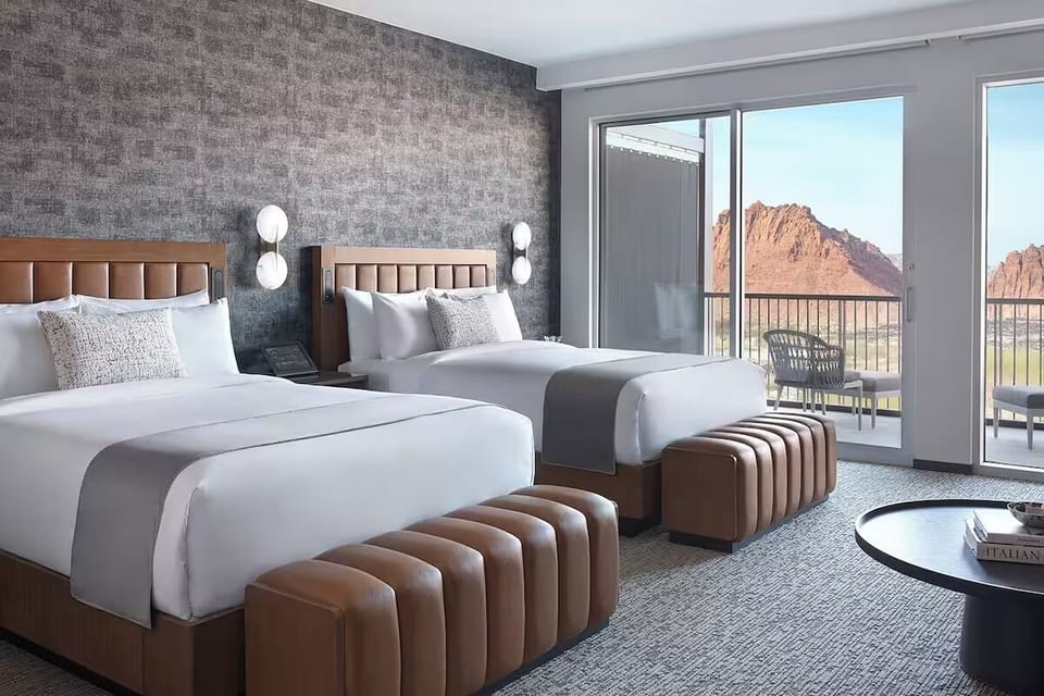 Stretch out in plush beds with balcony mountain vistas.