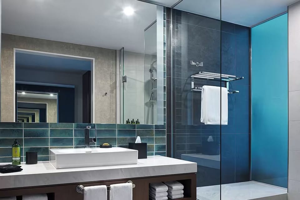 Refresh under the sleek glass shower with spa-like serenity.