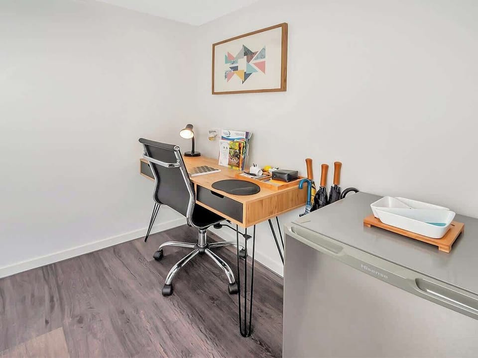 The apartment benefits from a dedicated workspace with free Wi-Fi throughout, ideal for those travelling on business or needing to catch up on emails.
