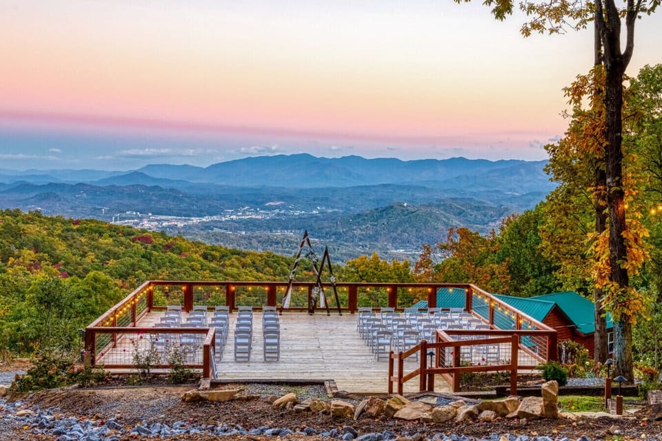 A Scenic Mountain Wedding Venue with a Panoramic Ceremony Deck and Lodging for Your Entire Celebration.